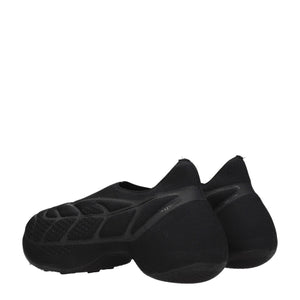 Slipper aus schwarzem Stoff