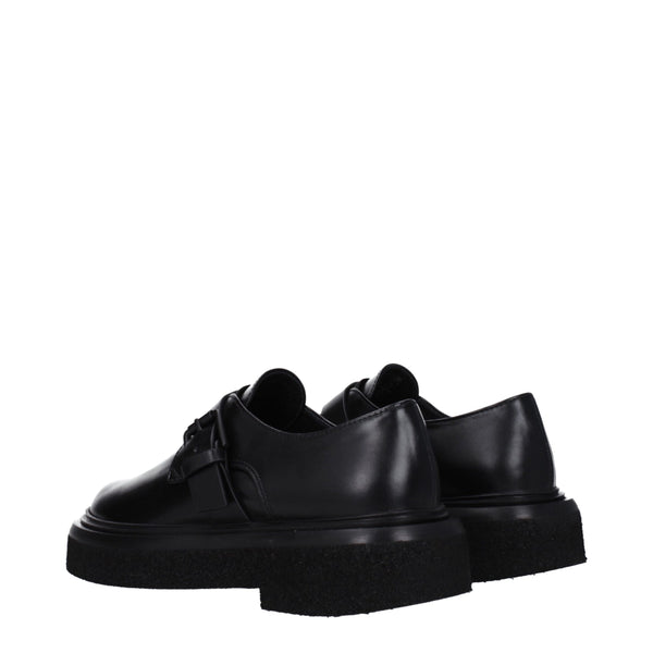 Schwarze Leder Oxfords und Derbies