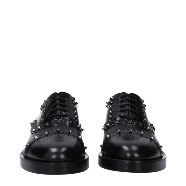 Schwarze Leder Oxfords und Derbies