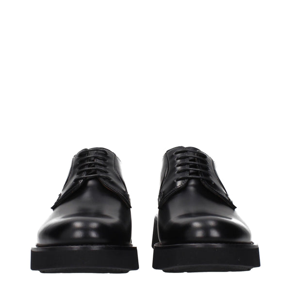Schwarze Leder Oxfords und Derbies